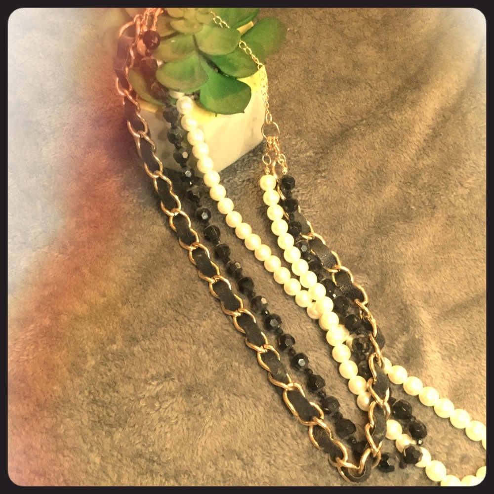 3 strand necklace with leather, pearls, and chain